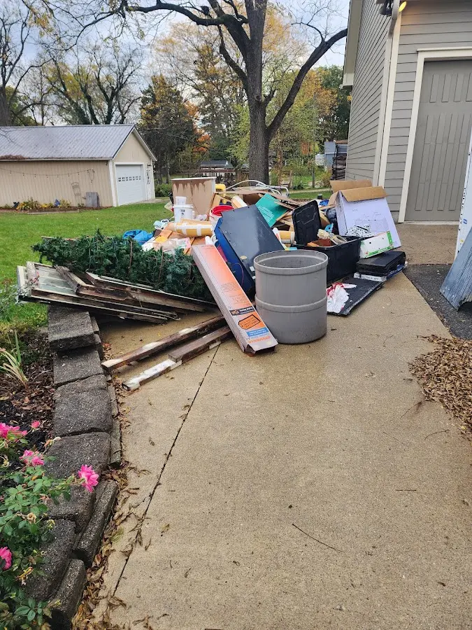 Dumpster being loaded with debris for Residential Dumpster Rental in Bellmead